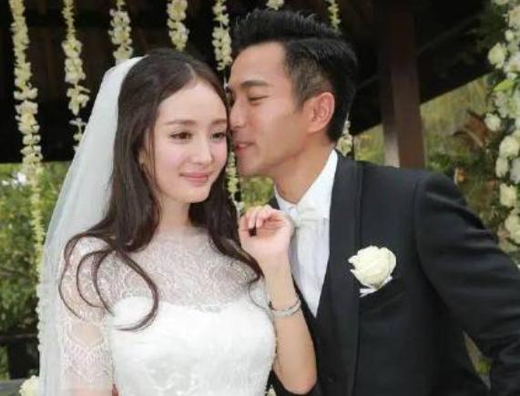 杨幂和长腿帅哥同回小区被拍！穿一身黑遮挡严实，男方站街头抽烟